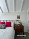 Guest bedroom in Resene Rice Cake with the ceiling highlighted in Resene Ceiling Paint White.