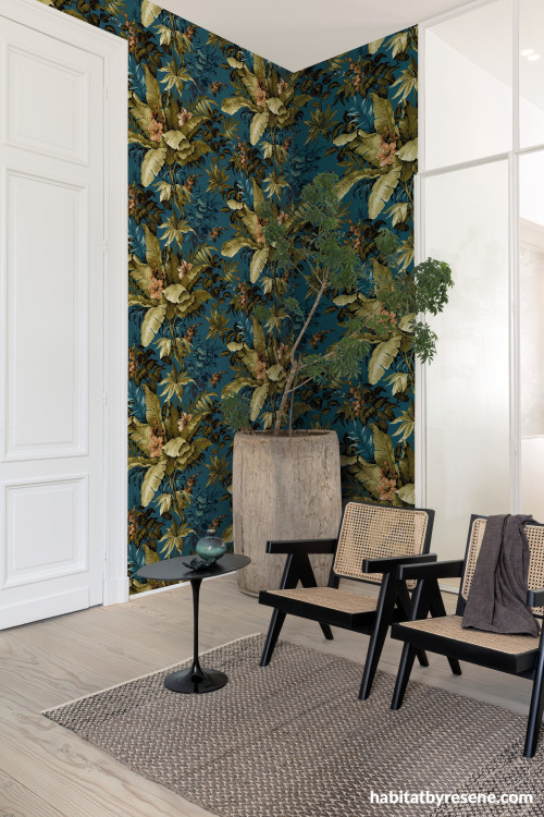 Sitting room featuring nature-inspired wallpaper