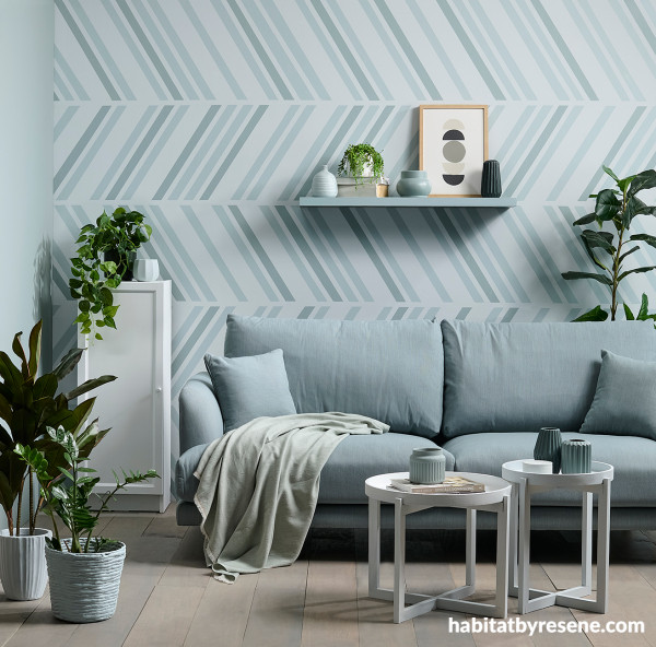 Get your graphic groove on by going diagonal on a feature wall that sings the blues in varying tones. 