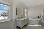 Bathroom spa ensuite Resene Double Parchment and Resene Half Spanish White