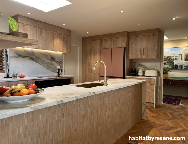 Kitchen with wood features and painted in Resene Wheatfield