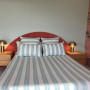 Bedroom featuring Resene wallpaper and painted in Resene Rainee