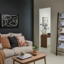 Living area with moody feature wall painted in Resene Nocturnal and side wall in Resene Quarter Akaroa