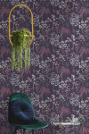 Wallpaper with violet tones creates moody meadow atmosphere in room