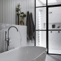 Bathroom in soft white and grey tones creates a luxurious atmosphere