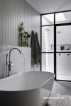 Bathroom in soft white and grey tones creates a luxurious atmosphere