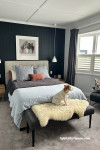 Dark and light tones in bedroom create luxurious vibe