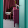 Bedroom furniture featuring Resene Cardinal and doors and trims in Resene Aqua