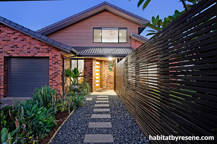 House exterior featuring weatherboards in Resene Wombat, fence in Triple Friar Greystone