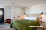 Master bedroom painted in light tones 