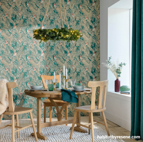 Wallpaper featuring green feather design in rustic dining space