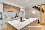 White walls in stylish kitchen brighten cooking space