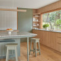 Kitchen with timber features, and painted in Resene Double Lemon Grass and Resene Quarter Thorndon Cream