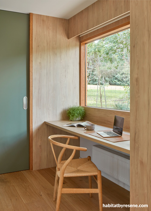 Workspace with timber walls and a door painted in Resene Double Lemon Grass