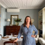 Vanya Wilkinson in her living room painted in Resene Half Periglacial Blue