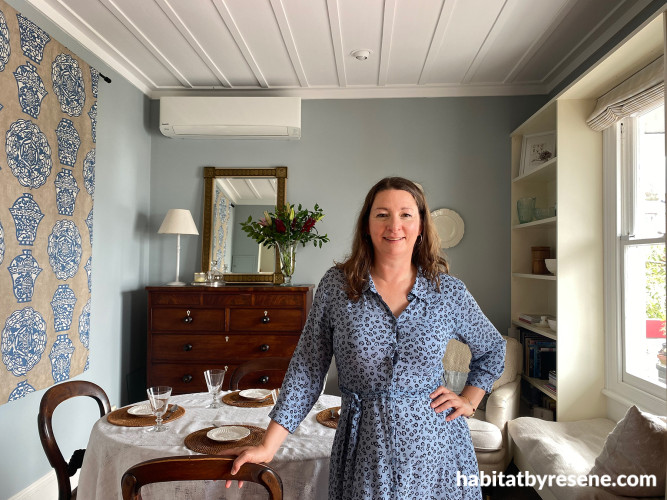 Vanya Wilkinson in her living room painted in Resene Half Periglacial Blue