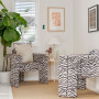 Living space featuring neutral white walls