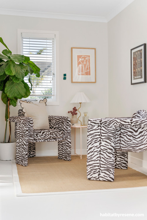 Living space featuring neutral white walls
