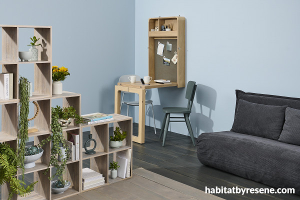 Different-coloured flooring and shelving units can help section off parts of a room. This foldout desk with interior cork pinboard is finished in Resene Colorwood Rising Tide and blackboard in Resene FX Blackboard Paint. 