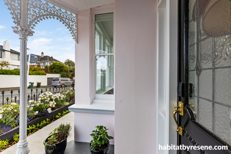 Villa house exterior painted in pale pink Resene Sauvignon