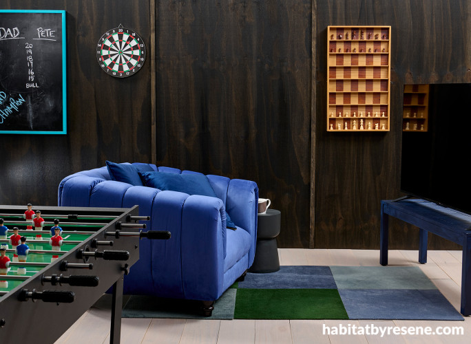Man cave or games room featuring timber wall panels stained in Resene Colour Enhance Japan Black