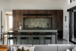 Kitchen featuring kitchen island with panels painted in Resene Double Stonewall