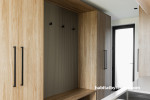 Utility space featuring wood finish and black hardware