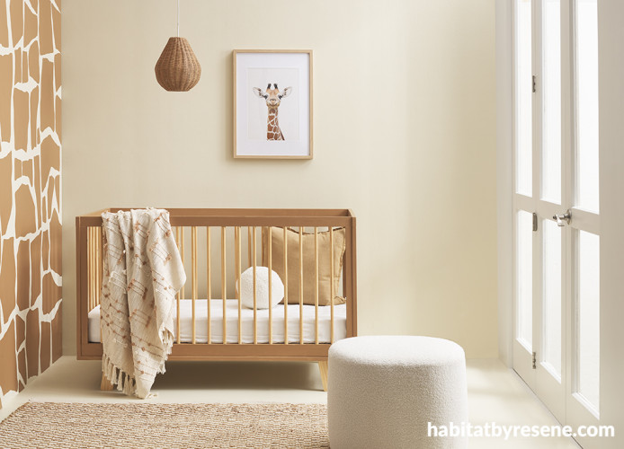 A nursery with a giraffe pattern