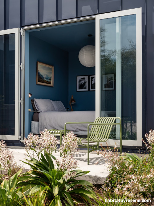 The guest bedroom is drenched in Resene Blue Moon