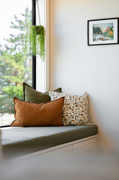 Warm neutrals and blush hues bring this Oratia home to life