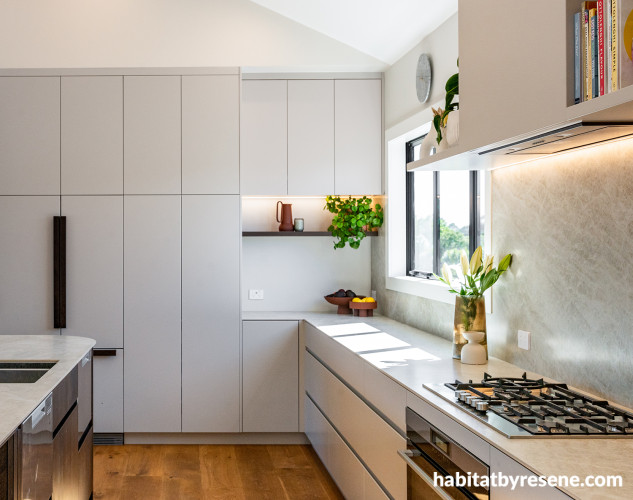 Kitchen cabinets painted in Resene AquaLAQ in Resene Truffle and ceiling in Resene Quarter Rice Cake