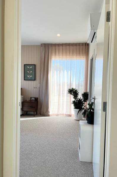 Warm neutrals and blush hues bring this Oratia home to life Warm neutrals and blush hues bring this Oratia home to life