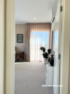 Master bedroom with walls painted in Resene Shabby Chic and ceiling in Resene Quarter Rice Cake