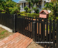 Fence painted in Resene Lumbersider in Resene Black