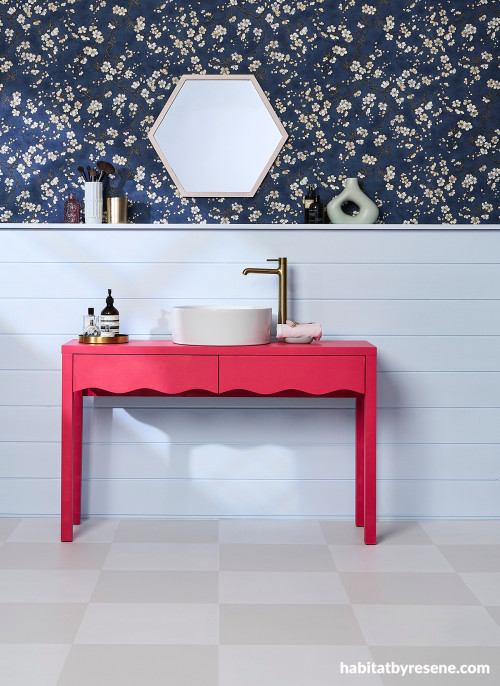 Bathroom featuring light blue and bright pink tones