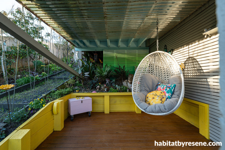 Outdoor garden and patio area featuring yellow and green tones