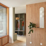 Entryway with wooden shelves and walls painted in Resene Double Lemon Grass