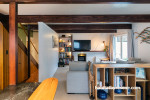 Living room, living room featuring neutral walls and exposed beams