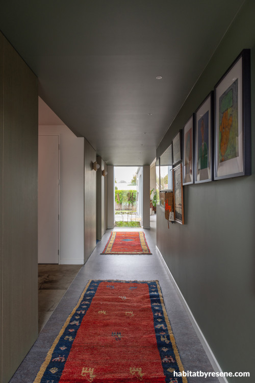 Hallway painted in refined green Resene Rivergum
