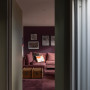 Hallway and family room panted in vibrant burgundy Resene Aubergine