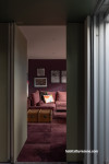 Hallway and family room panted in vibrant burgundy Resene Aubergine