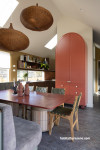 Kitchen and dining area painted in Resene Bullwhip and Resene Quarter Thorndon Cream