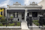 A home with a black painted fence