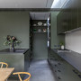A dark green kitchen