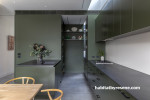 A dark green kitchen