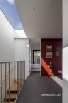 A hallway with a red wall