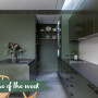 A dark green kitchen