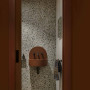 Powder room entry wall and door in Resene Pioneer Red