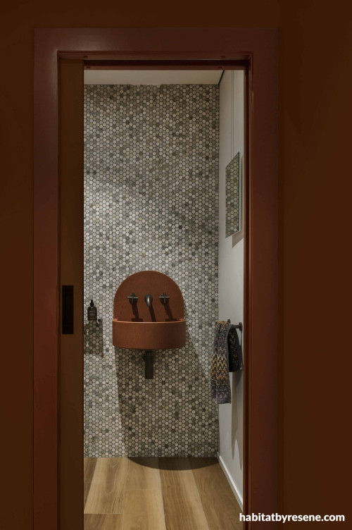 Powder room entry wall and door in Resene Pioneer Red