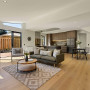Living area and kitchen featuring neutral and earthy colours